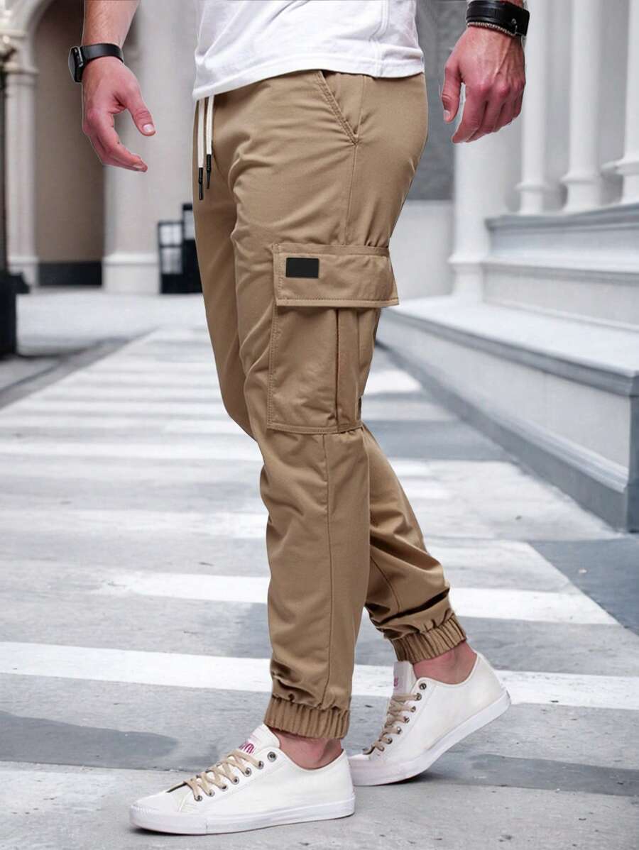 Men's modern urban cargo trousers in beige with cargo pockets and elasticated ankle cuffs