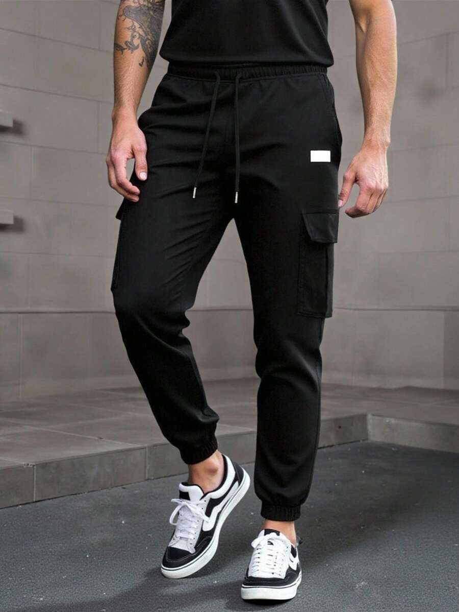 Men's modern urban cargo trousers in beige with cargo pockets and elasticated ankle cuffs