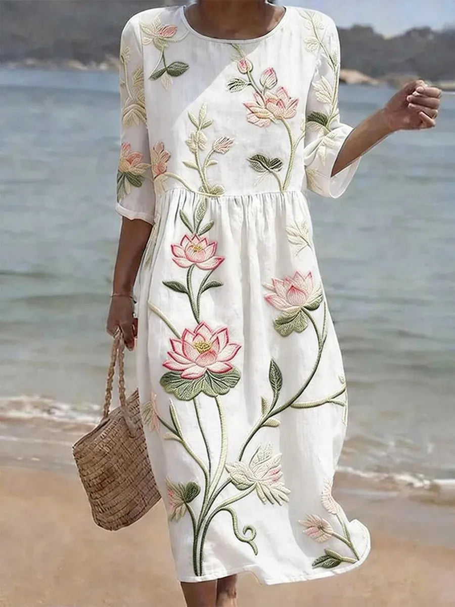 Loose-fit floral print dress with a soft, flowing silhouette in a classic flower and leaf pattern