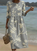 Relaxed flowing midi dress with a delicate botanical floral and plant print