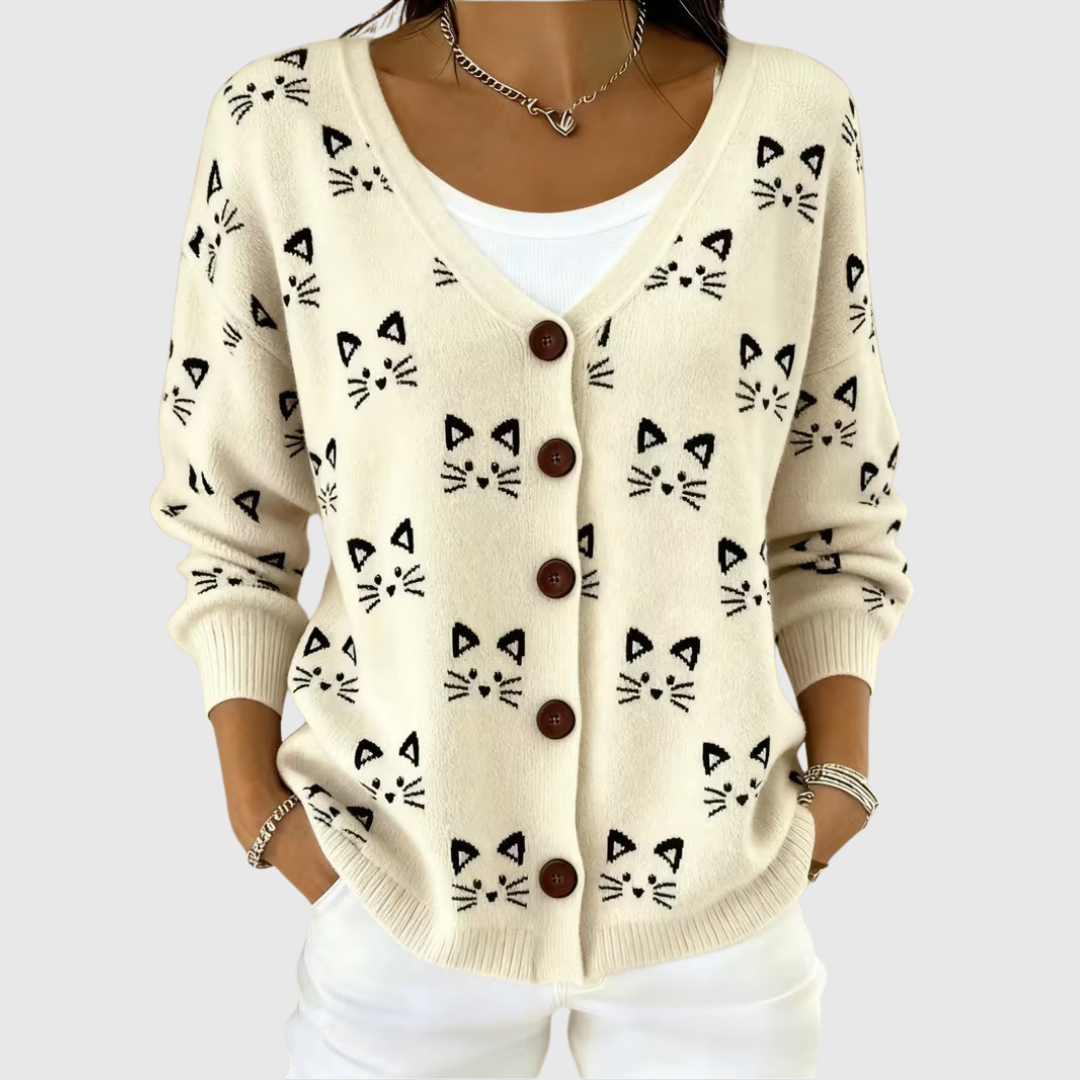 A woman wearing a buttoned comfort cardigan open over a blouse on a cool spring day.