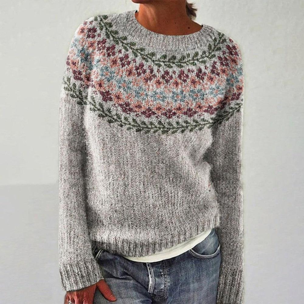 A woman wearing a round-neck jumper with a colourful Nordic pattern, cosy for autumn.
