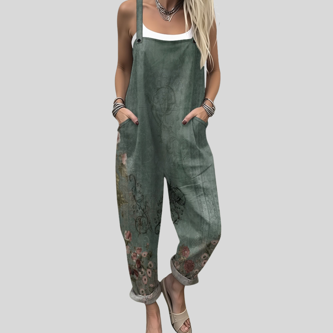 Woman wearing the Eimear™ warm khaki green harem-leg dungarees with a delicate all-over vintage botanical print of flowers and trailing foliage.