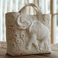 Quilted tote bag featuring a majestic elephant motif on a structured padded body with wave-stitch quilting