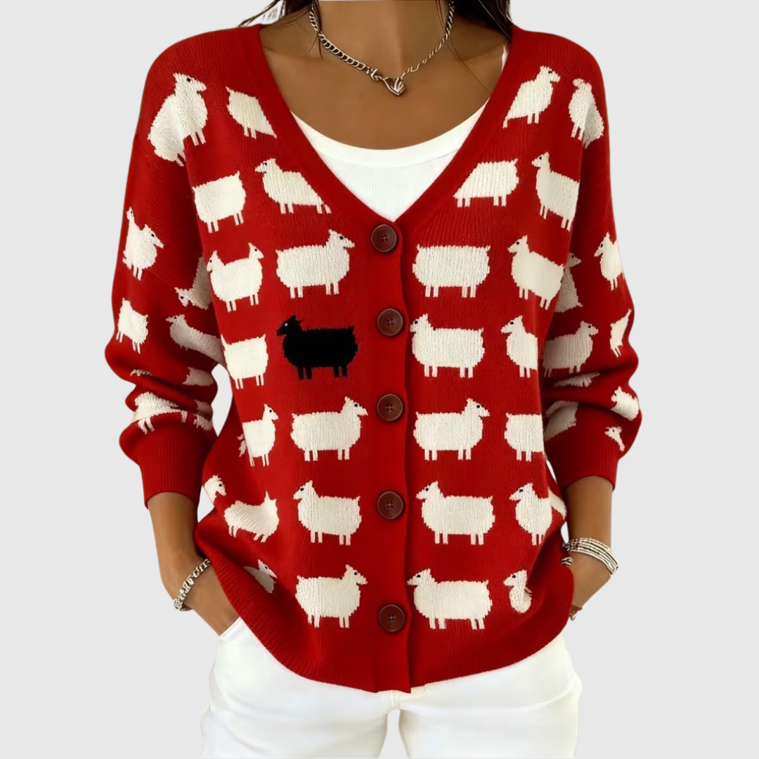 A woman wearing an essential buttoned cardigan closed like a jumper, standing confidently.