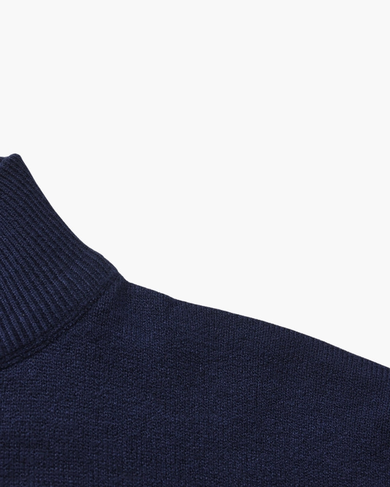 Men's black ribbed roll-neck jumper with a clean structured silhouette