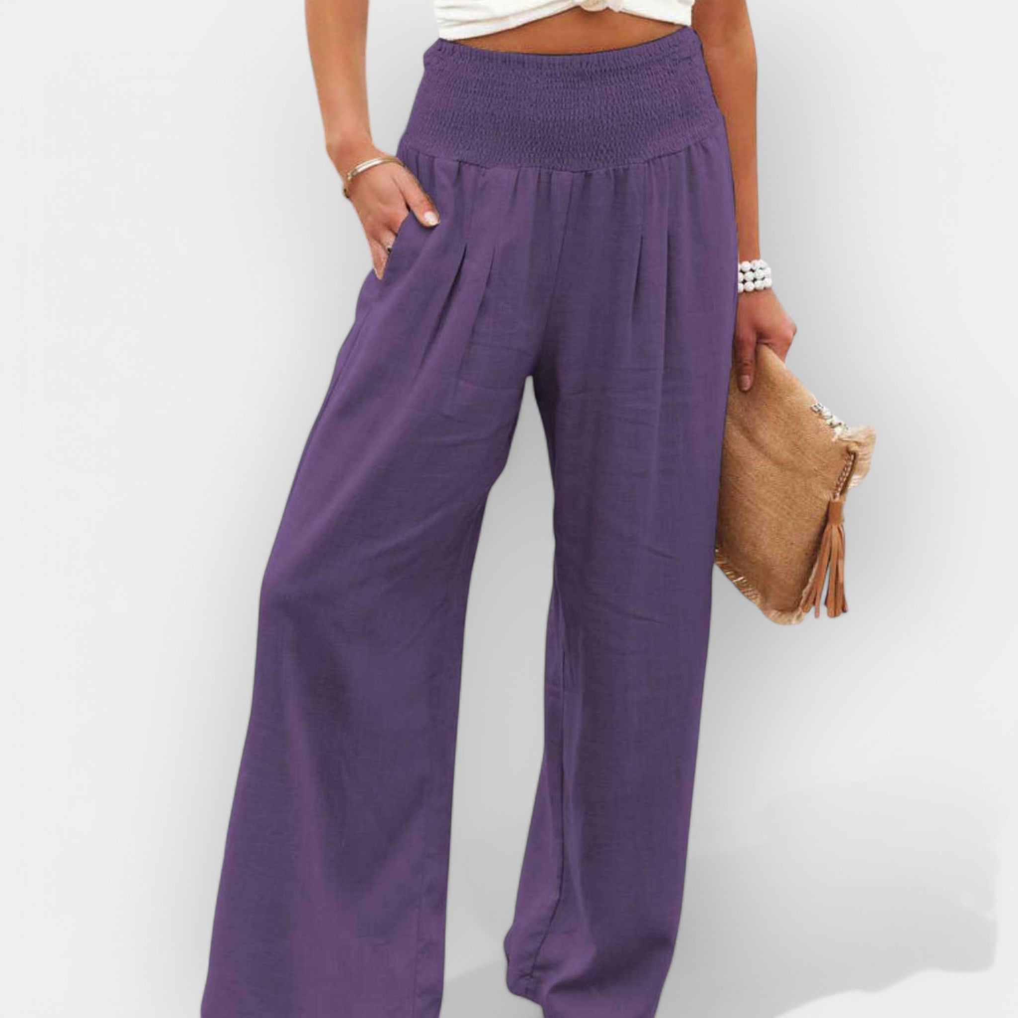 White wide-leg trousers with an elastic waist and a light, flowing silhouette