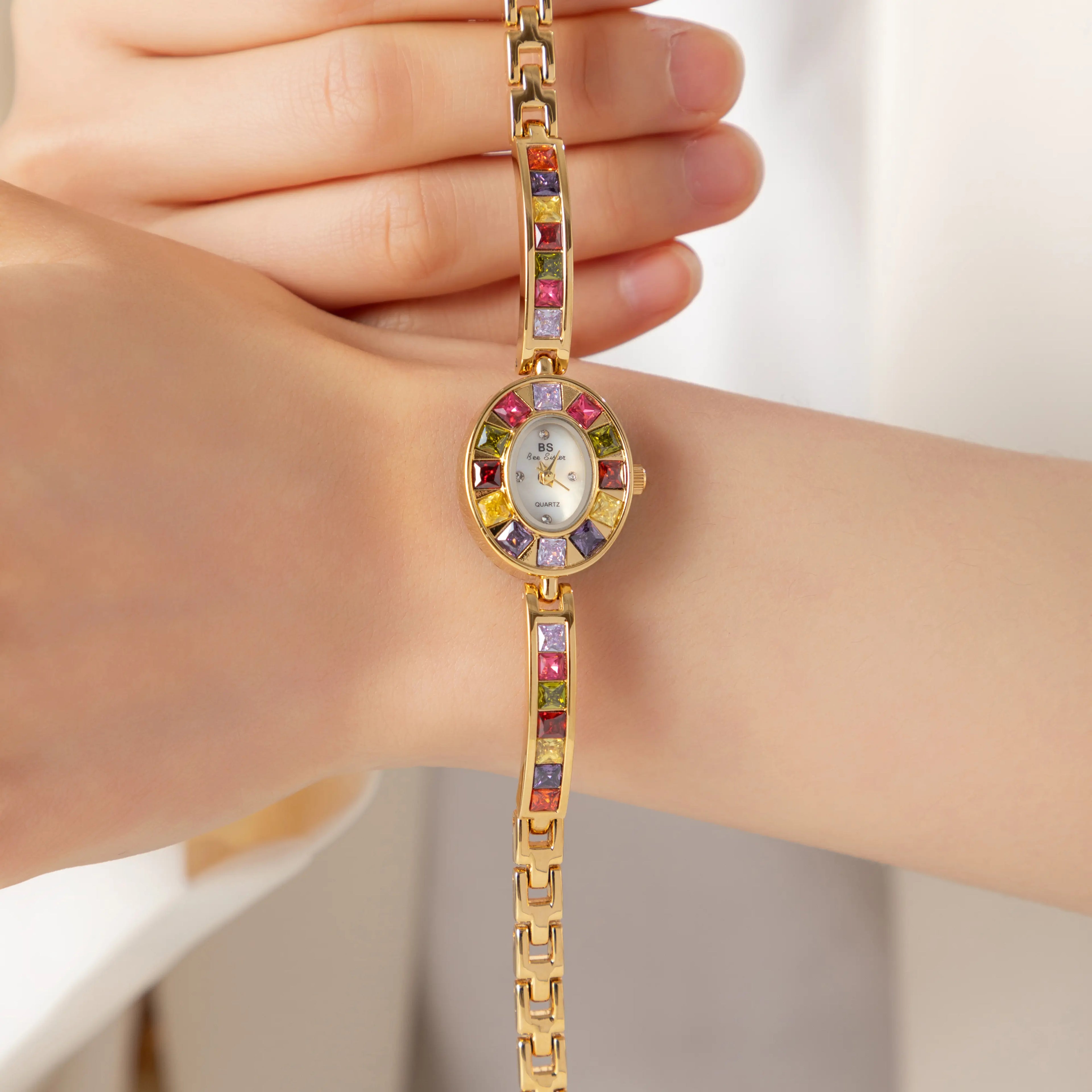 Women's colourful watch with golden detail trim in gold tones