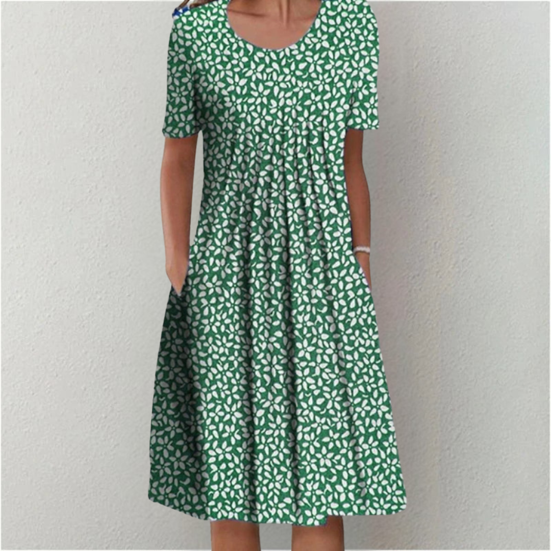 Woman wearing the floral midi dress with pockets, walking outdoors on a sunny day.