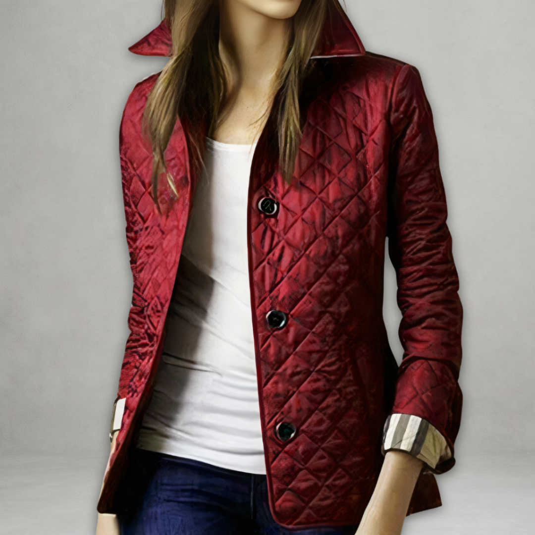 A woman wearing an autumn jacket over a top, layered for a crisp day in town.