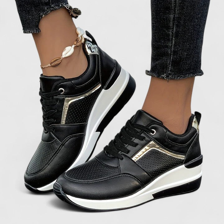 A woman standing comfortably in cushioned orthopaedic shoes
