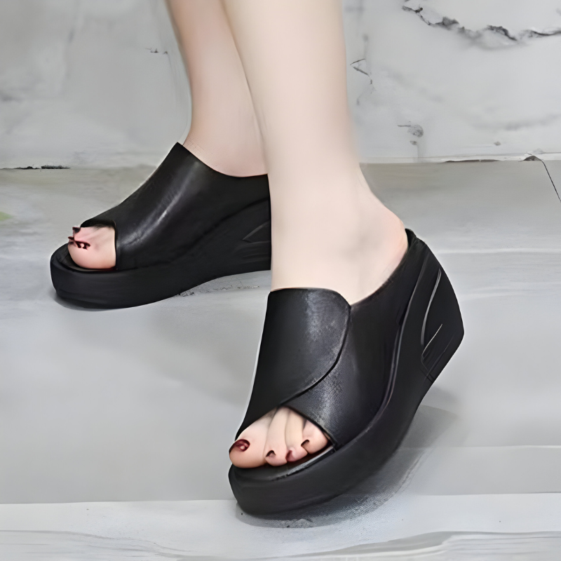 High platform backless sandals in black with a peep-toe front
