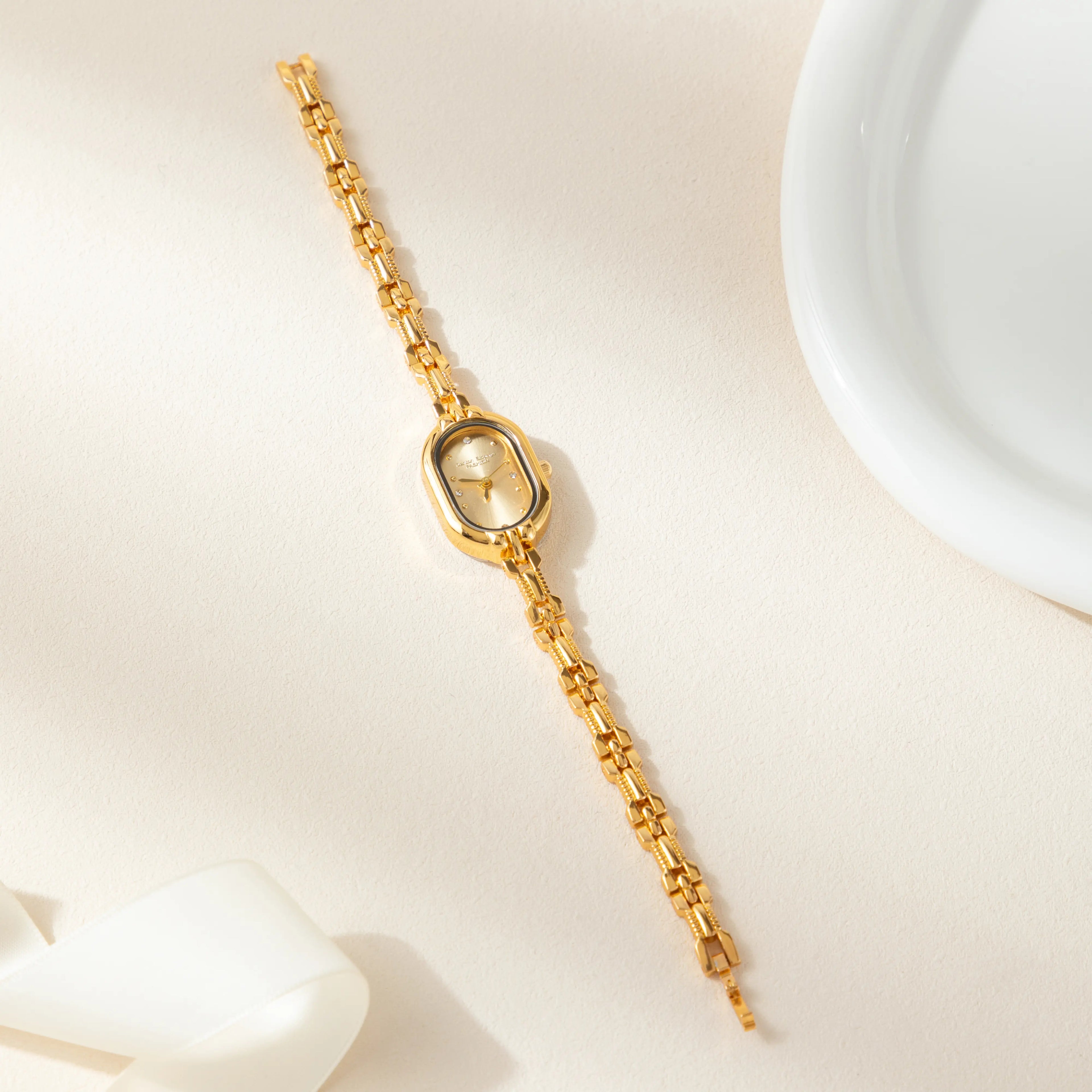 Women's slim minimalist watch with a clean dial and fine strap in a classic finish