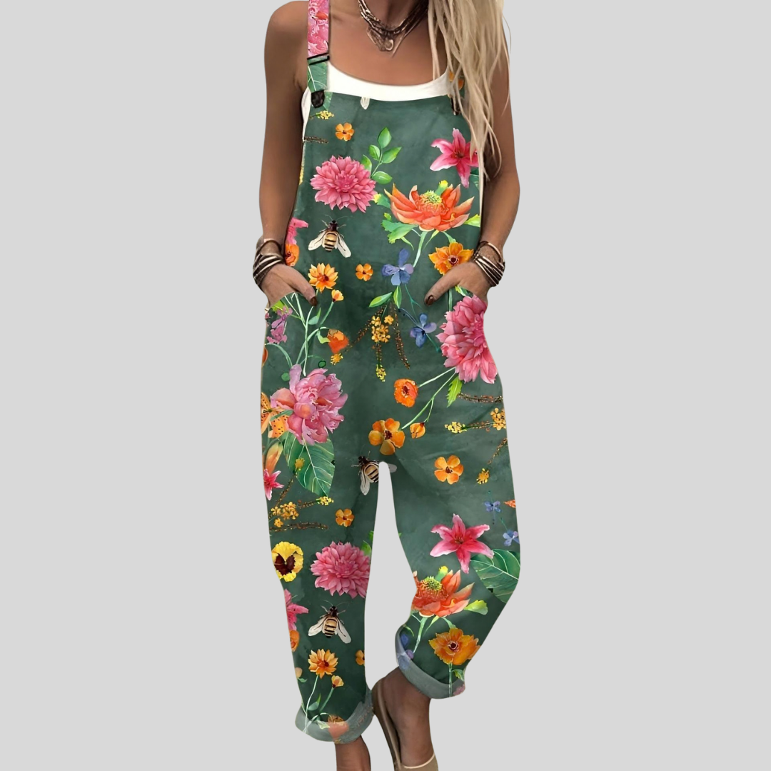 Women's wide-leg dungarees in deep forest green with bold large floral print in pink, magenta, orange and yellow, from Mary Cork Ireland.