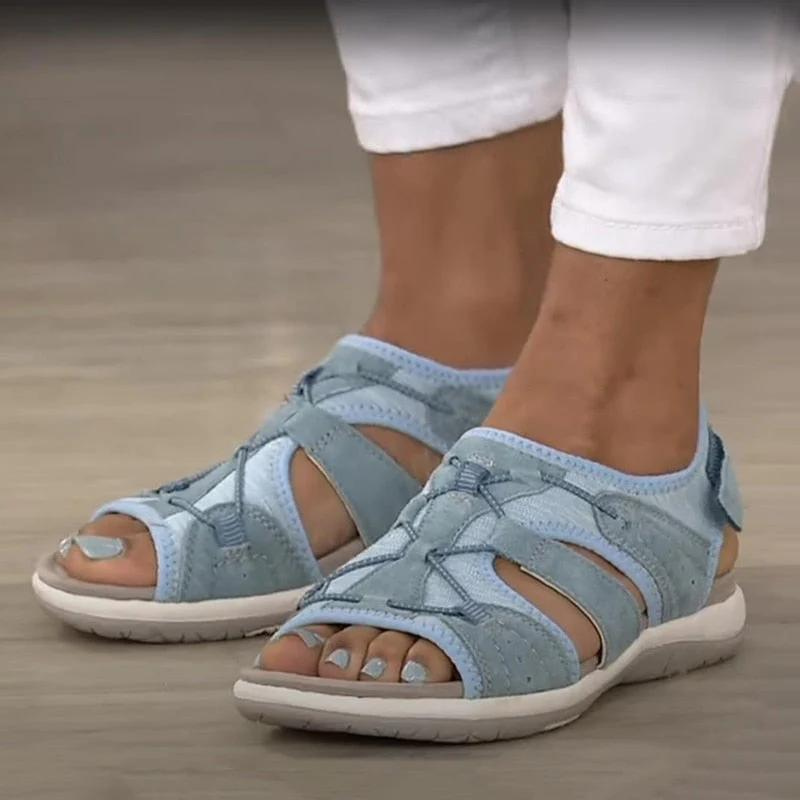 Blue closed sport sandals with adjustable straps and cushioned sole