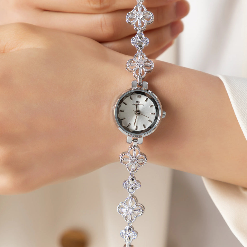 Women's gold-finish watch with rounded design and light-catching detailed face