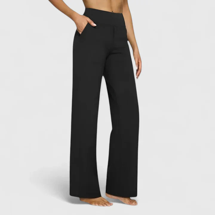 A woman in elegant straight-leg trousers with pockets, styled for a polished everyday look.