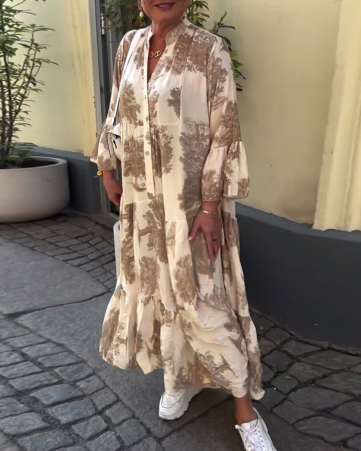 Woman wearing the Abigail flowing maxi dress with a delicate print and V-neckline, the skirt moving softly as she walks.