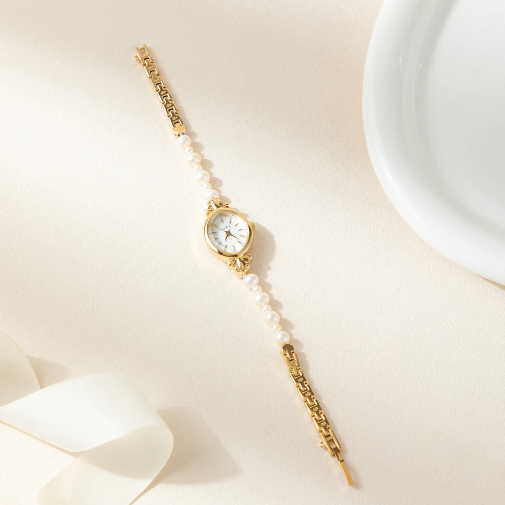 Elegant women's watch with crystal-set dial and delicate golden bracelet strap