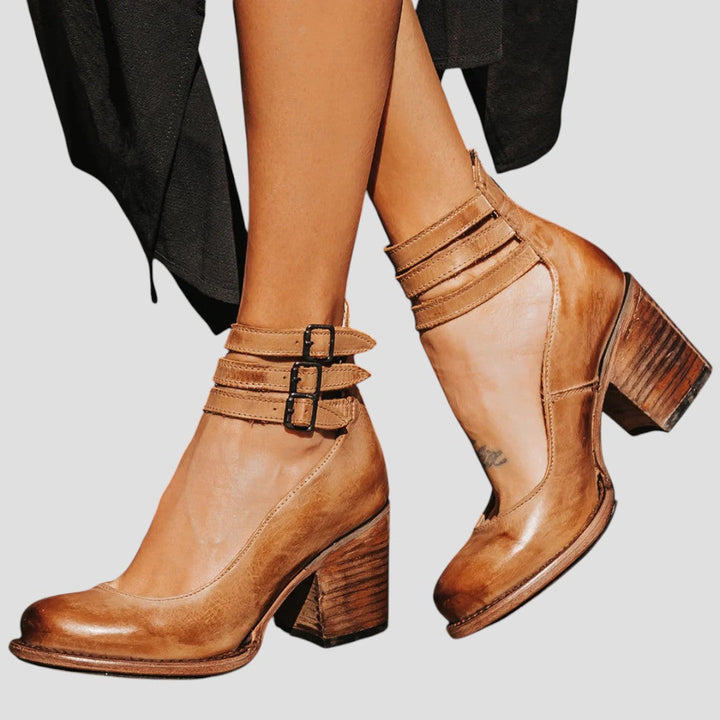 A woman walking on an autumn day wearing elegant wide-fit orthopaedic boots.