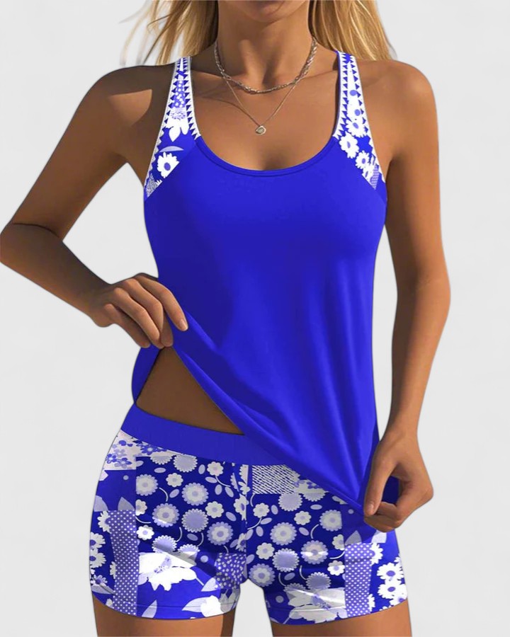 A woman wearing a comfortable swimsuit with a lively print, relaxed and carefree by the pool.