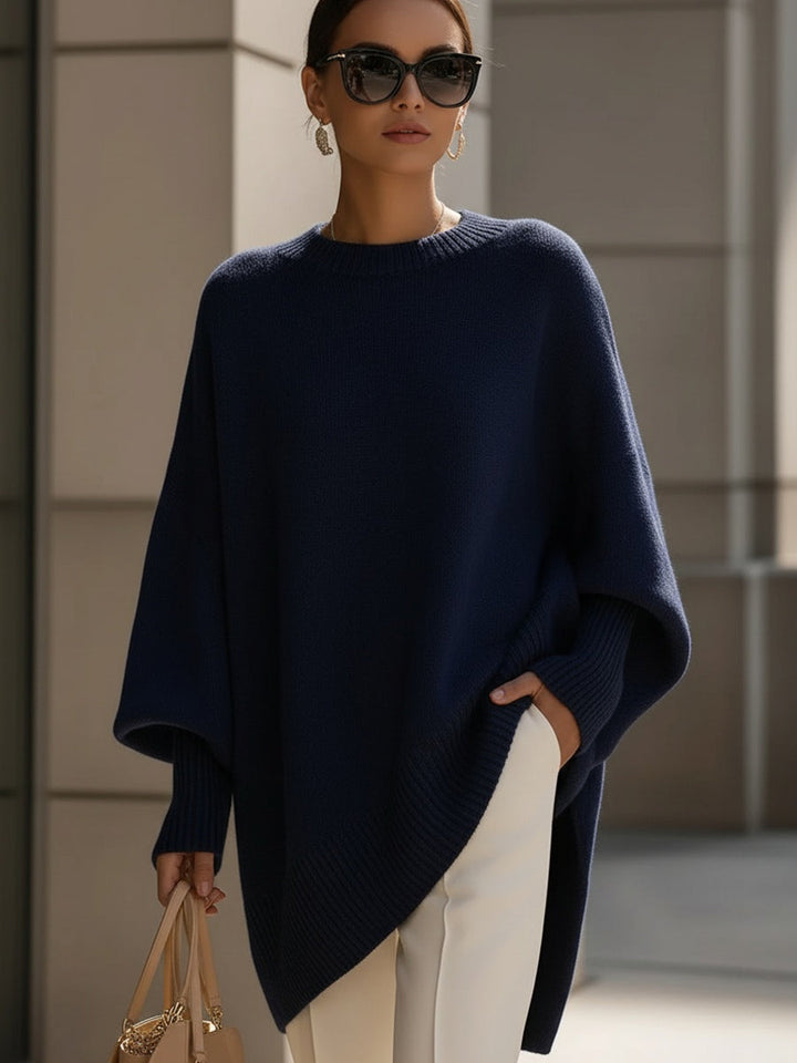 A woman wearing a soft crew neck jumper with jeans for a warm, easy everyday look.