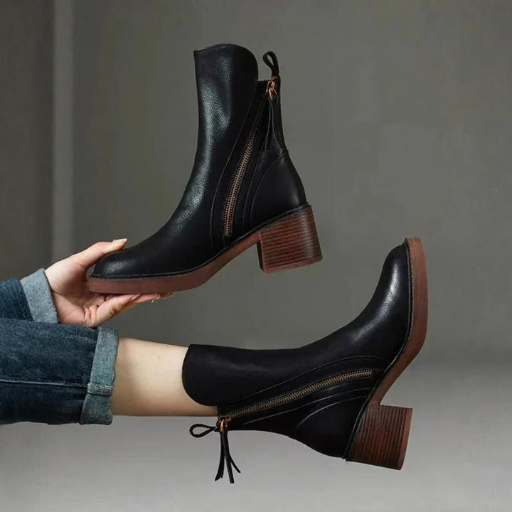 Classic black ankle boots with a stable heel and side zip fastening