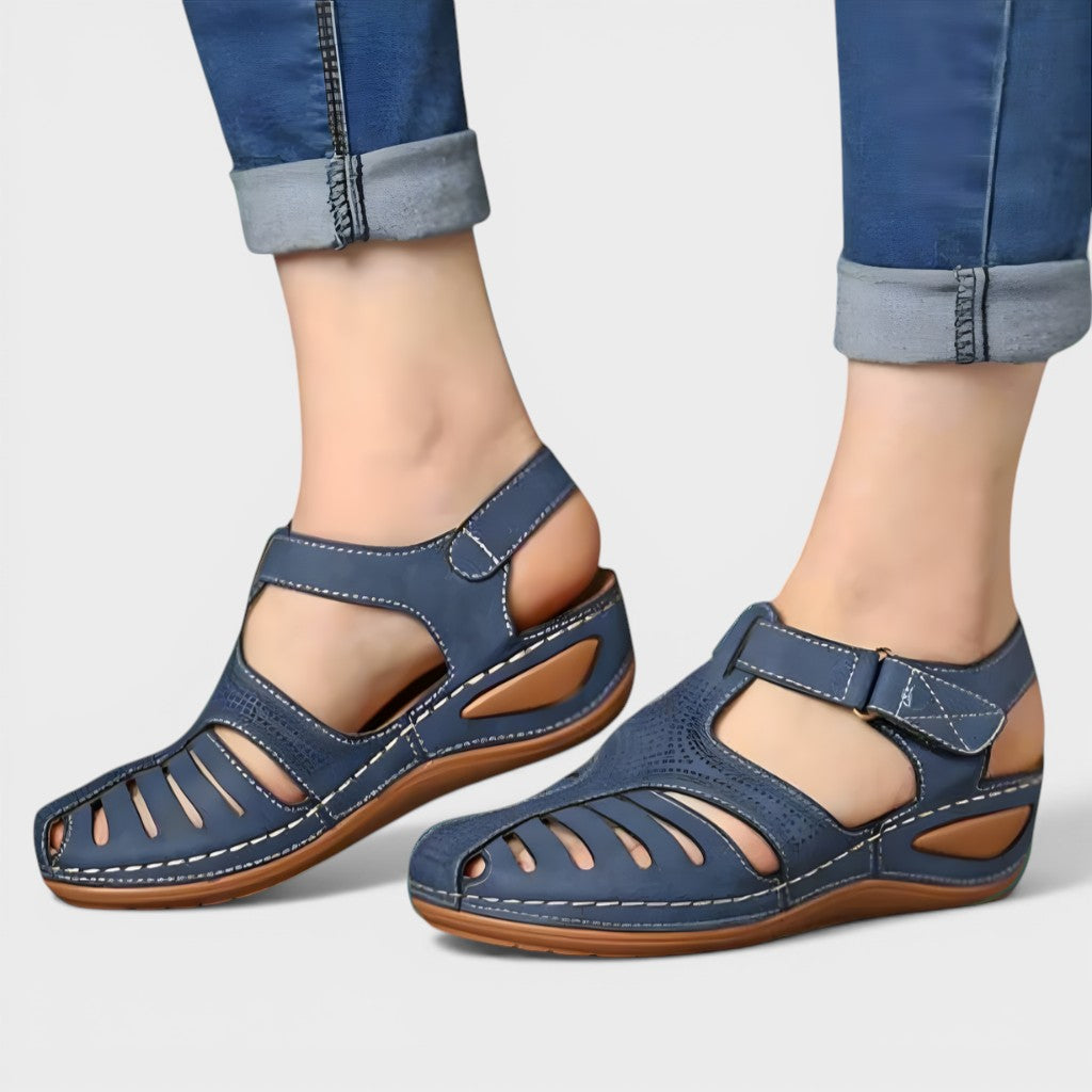 Orthopaedic corrective sandals in navy and burgundy with a supportive, adaptive design