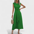 A sleeveless round-neck maxi dress in sage green with a clean, elegant silhouette