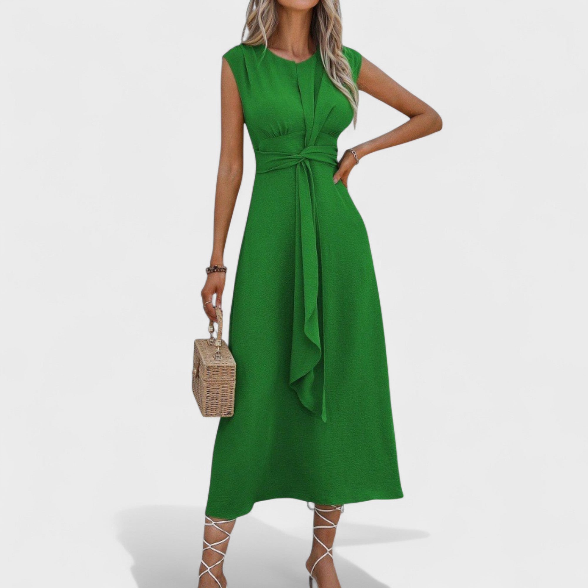 A sleeveless round-neck maxi dress in sage green with a clean, elegant silhouette