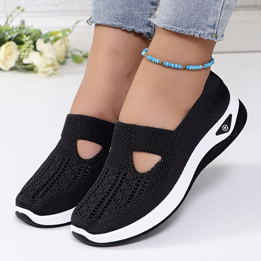 A woman stepping into easy slip-on comfort trainers with no laces.