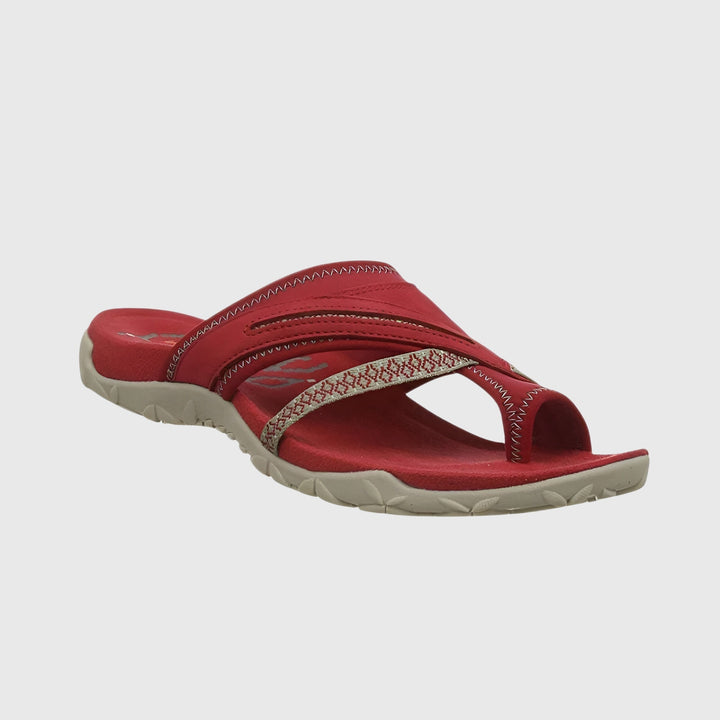 A woman wearing open-toe supportive sandals with a light summer outfit, walking comfortably and looking confident.