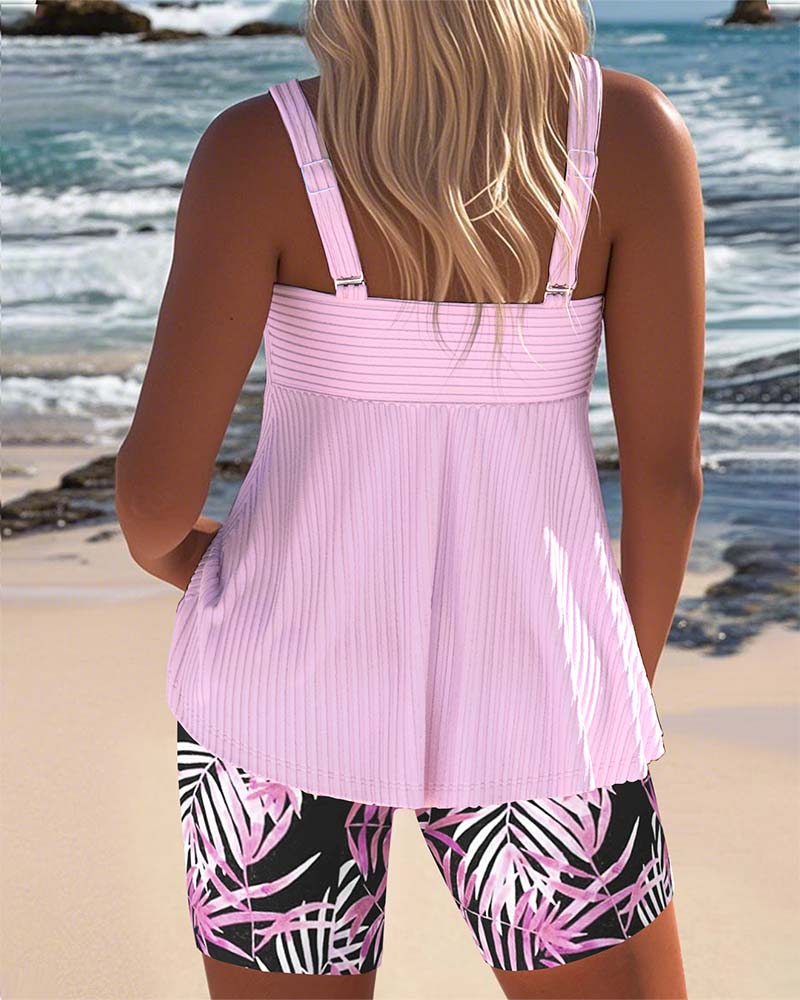 Printed tankini swimsuit in cyan with a colourful patterned bottom