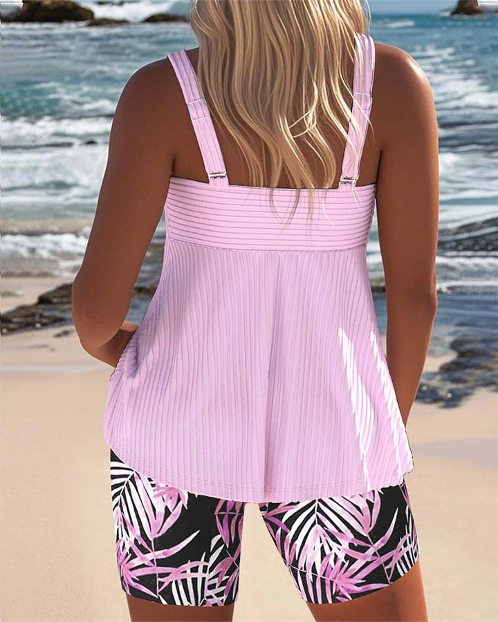 Printed tankini swimsuit in cyan with a colourful patterned bottom