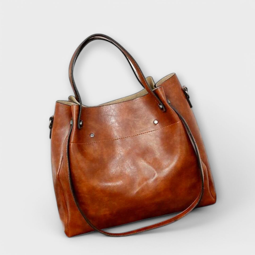 A woman carrying a coordinated vintage-style four-piece bag set on a day out