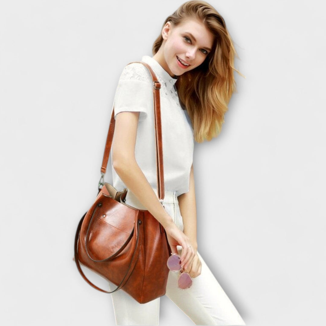 A woman carrying a coordinated vintage-style four-piece bag set on a day out