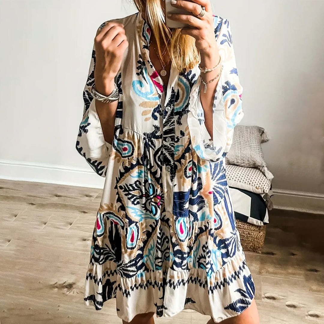 A woman wearing a relaxed boho print tunic dress on a warm, sunny day.