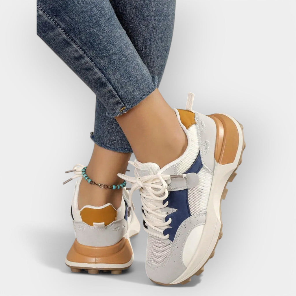 Women's ergonomic daily trainers with cushioned sole in a modern clean design