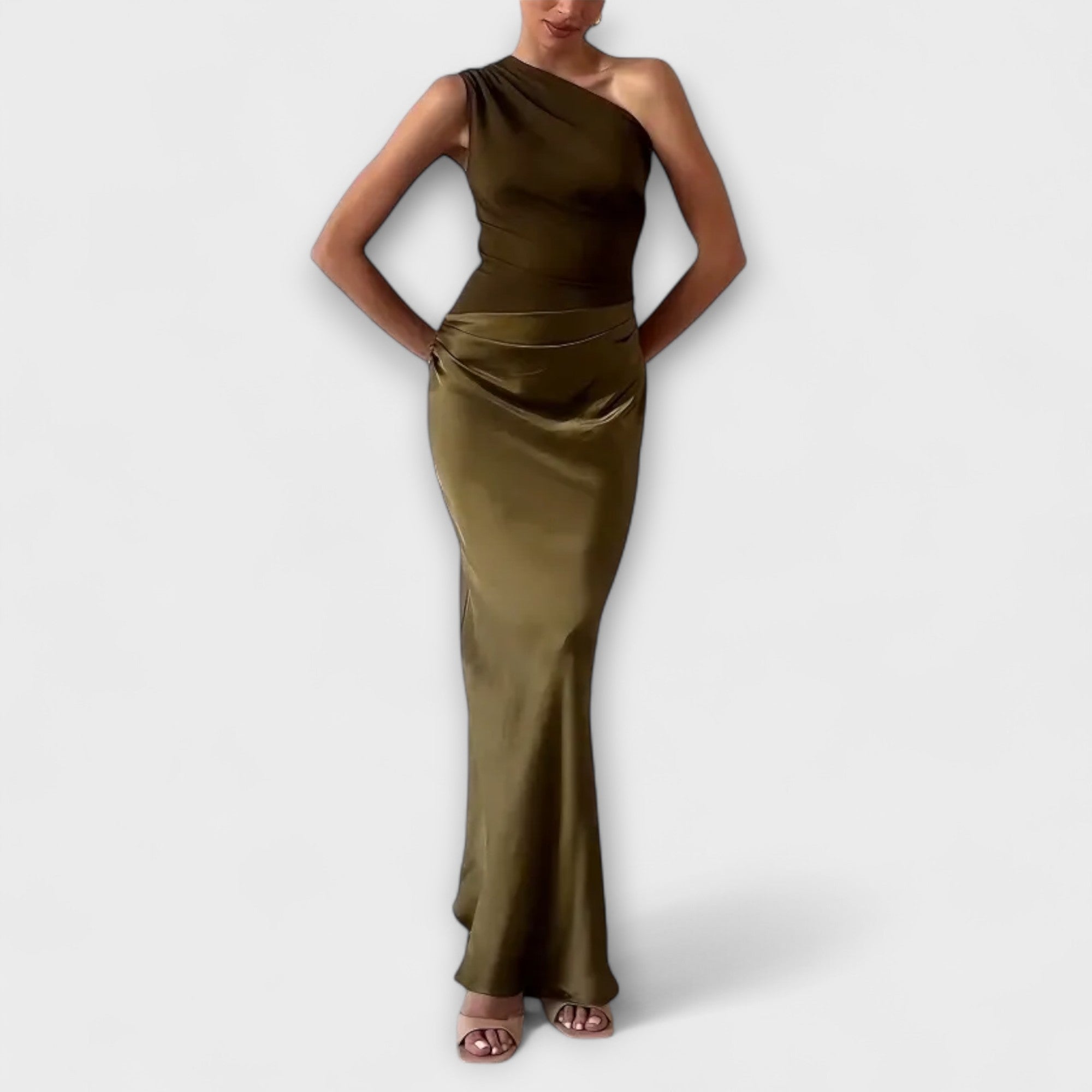 One-shoulder pleated maxi gown in rich dark green with a sweeping full-length skirt