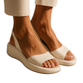 Minimal flat sandals in white, pink, blue, yellow and orange with a cushioned supportive sole