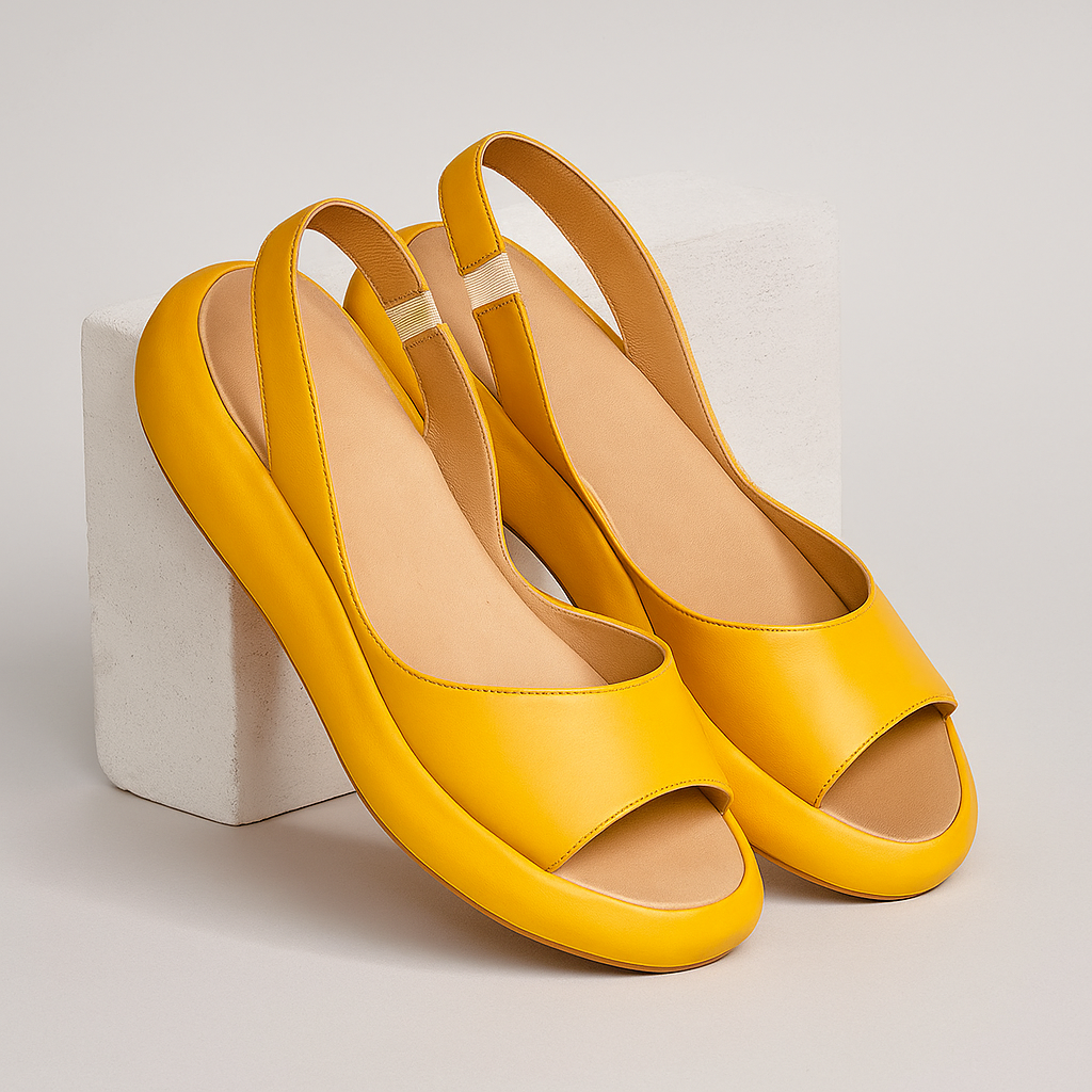 Minimal flat sandals in white, pink, blue, yellow and orange with a cushioned supportive sole