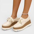 Women's platform trainers in beige with a cushioned sole and glossy contemporary finish