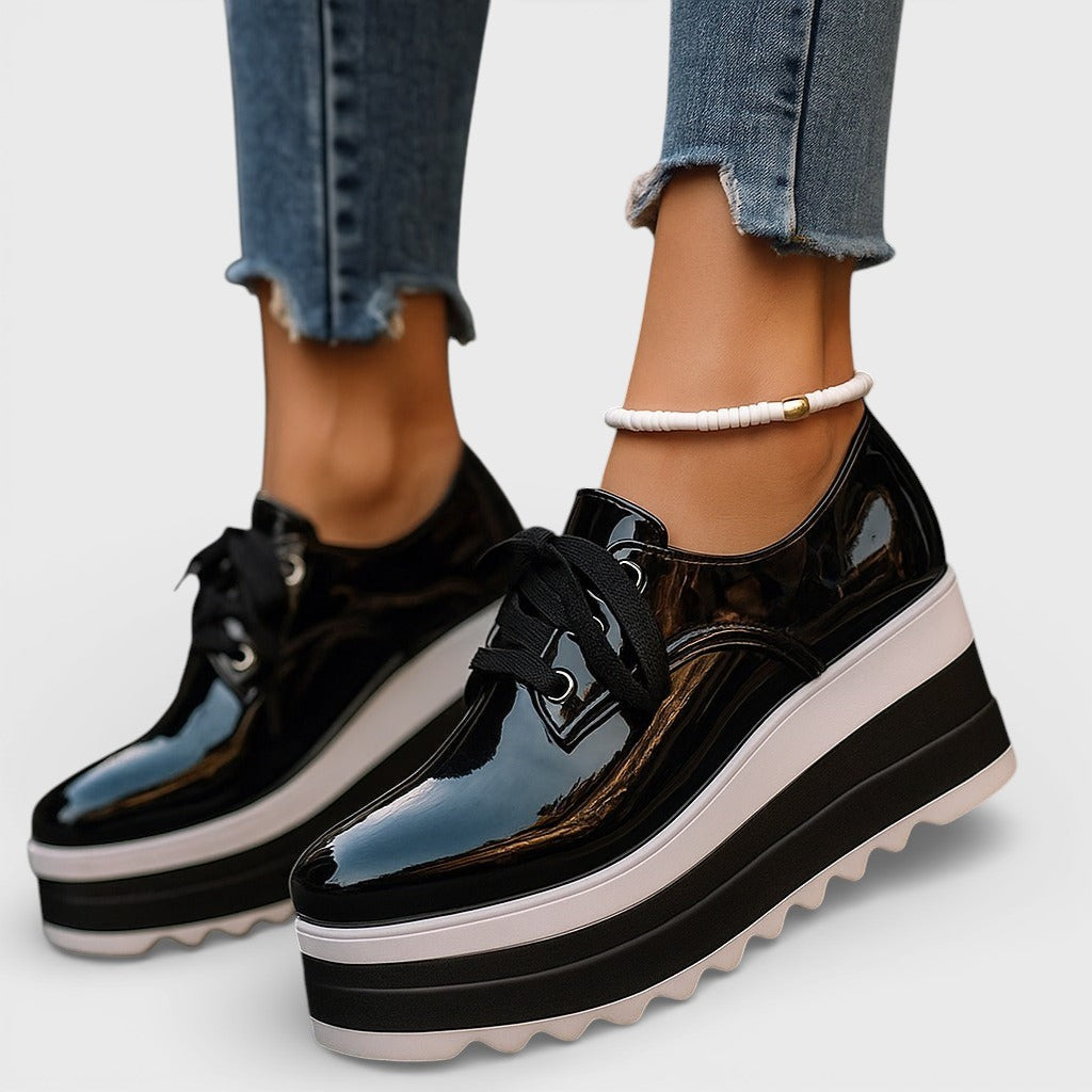 Women's platform trainers in beige with a cushioned sole and glossy contemporary finish