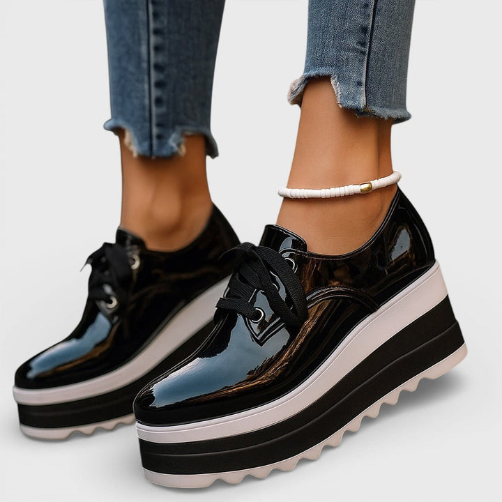 Women's platform trainers in beige with a cushioned sole and glossy contemporary finish