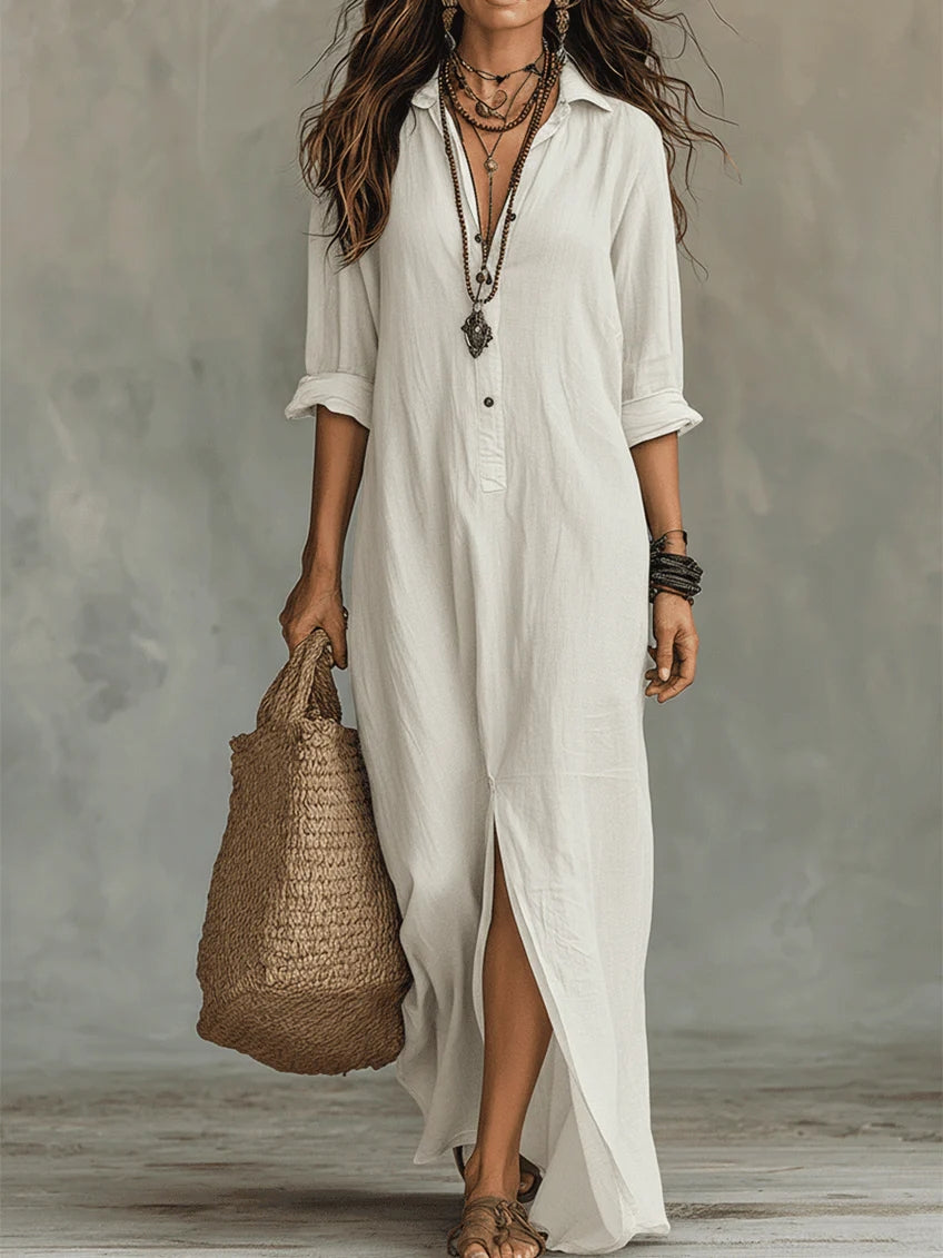 Elegant floaty maxi dress in black with a flowing full-length silhouette and structured bodice