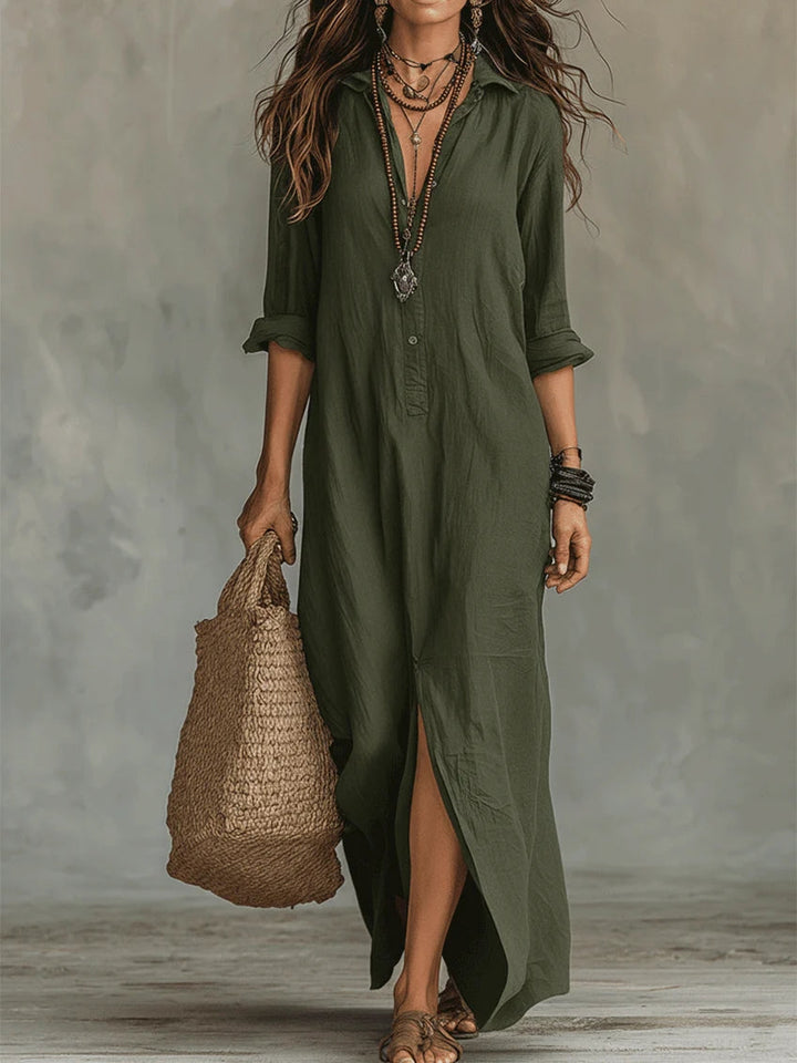 Elegant floaty maxi dress in black with a flowing full-length silhouette and structured bodice