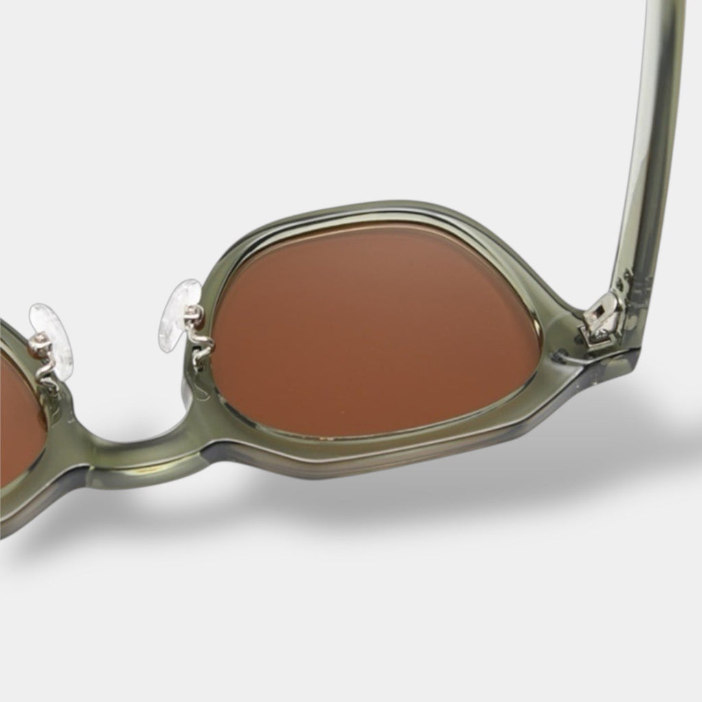 Yacht-inspired round polarised sunglasses with a lightweight frame in green-brown tones
