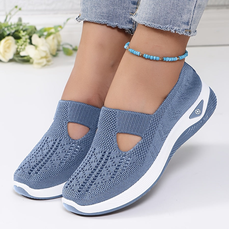 A woman stepping into easy slip-on comfort trainers with no laces.