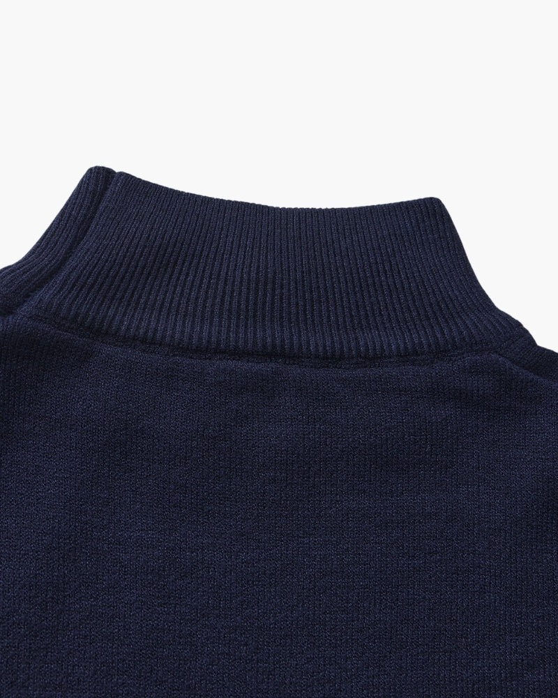 Men's black ribbed roll-neck jumper with a clean structured silhouette