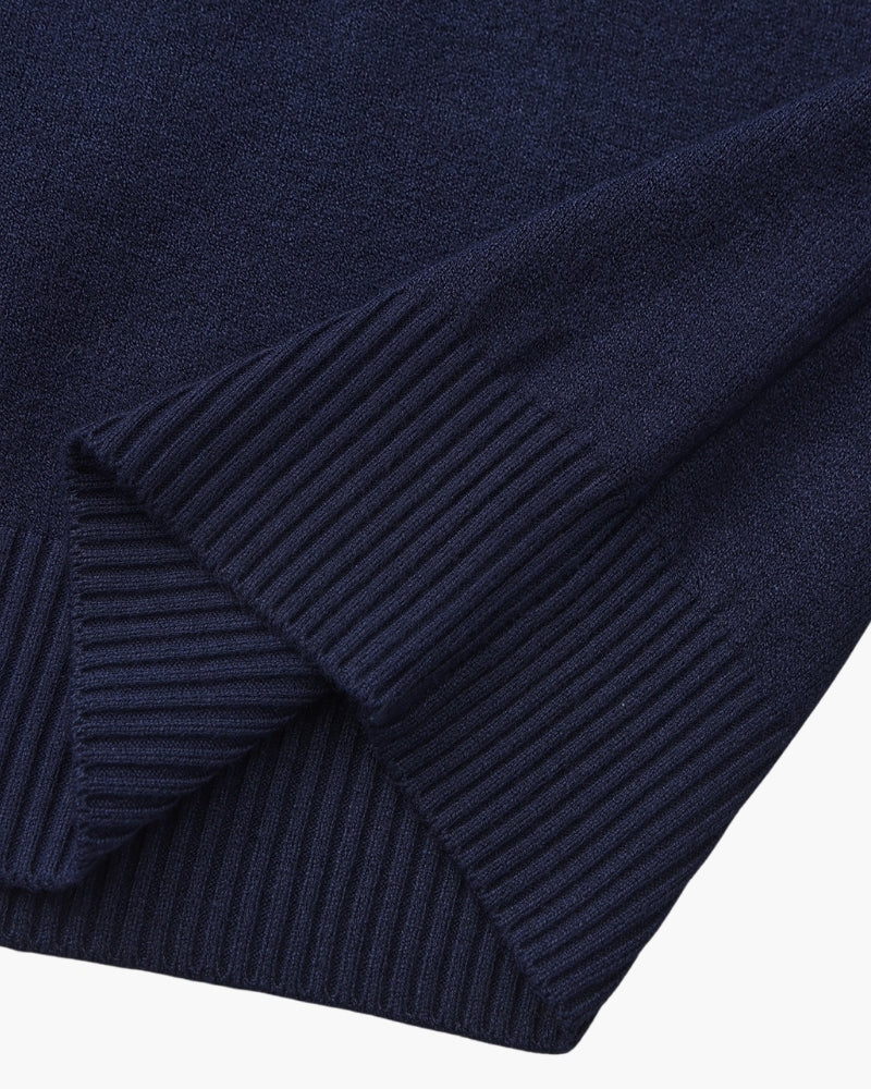 Men's black ribbed roll-neck jumper with a clean structured silhouette